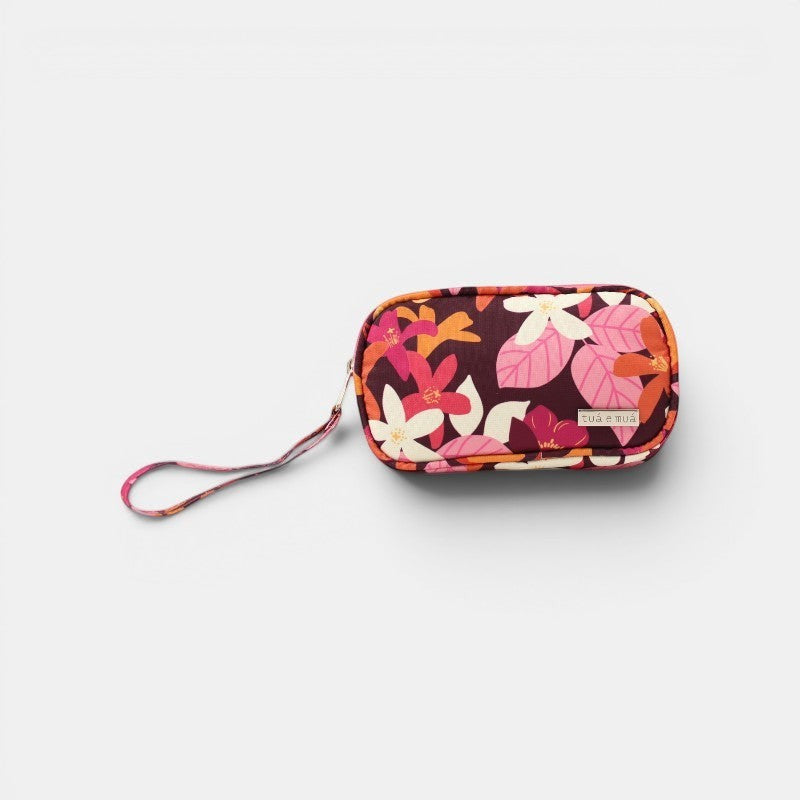 Cartera de mano Elena de tua e muá con estampado floral en tonos burdeos, rosa, naranja y blanco. Lona impermeable con monedero interior.