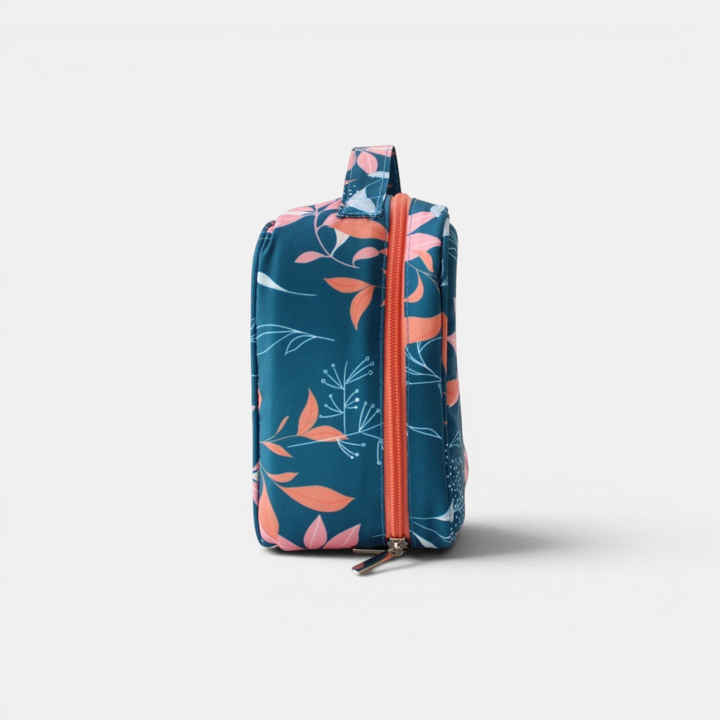 Neceser Evelyn de tuá e muá con estampado floral azul y coral, dos bolsillos con cremallera y compartimento interior.