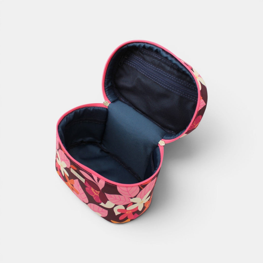 Neceser Glam Elena de tuá e muá con estampado floral burdeos, rosa, fucsia, blanco y naranja. Cilíndrico con cremallera fucsia.